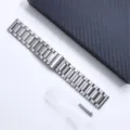 Detail shot of the titanium metal watch band featuring a three-bead deployant clasp and spring bars. - 18mm / Silver