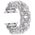 Close-up detail of the sparkling silver rhinestone four-petal flower metal watch strap. - Silver