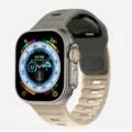 Smart watch with dual-tone silicone sport band and digital compass dial interface. - Dark Grey and Starlight