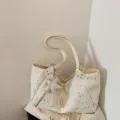 Detailed view of cream star print shoulder tote bag with cute star charm and zipper pocket. - With Pendant / Off White