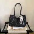 Black star print shoulder tote bag with front zipper pocket and cute star pendant detail. - With Pendant / Black
