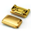 Close-up view of gold metal watch strap quick release link connectors, detailed metal texture. - 20mm / Gold