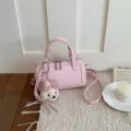 Pink leather pillow shoulder crossbody bag with cute puppy charm, stylish niche design. - With Pendant / Pink