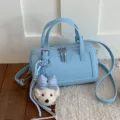 Light blue leather pillow bag for women, chic crossbody shoulder handbag with cute charm. - With Pendant / Blue