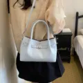 Bolso de mano elegante para mujer azul claro, bolso cruzado elegante con cierre metálico. - Azul