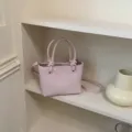 Rosa Eimer Tasche mit Knotengriffen, stylische Leder Schulter- und Umhängetasche für Damen. - Reguläre Passform / Rosa