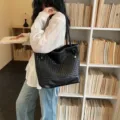 Black woven leather tote bag for women, stylish large capacity shoulder commuting handbag for daily use. - Black