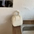 Minimalistische beige Henkeltasche im kleinen Retro-Design, ideal für den täglichen Damenstil. - Ohne Anhänger / Weiß