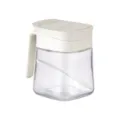 Clear glass spice jar with white lid, handle and spoon, ideal for kitchen seasoning storage. - Single Piece / Ivory