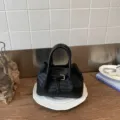 Black woven leather handbag with top handles and stylish buckle strap design for women daily use. - No Pendant / Black
