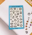 Cute cartoon sticker sheet with various doodle designs for journaling and crafting. - Blue