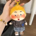 Detailed shot of a cute fluffy freckled plush doll keychain, showing cute facial features. - Fluffy Freckle - Serena