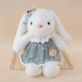 Cute white plush rabbit doll wearing green daisy dress and accessories, soft companion toy. - Rabbit in Green Dress