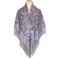 Detailed view of the grey traditional floral print shawl with elegant fringe and soft fabric. - Gray