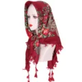 Detail shot of a deep red vintage floral print square headscarf with tassel trim and ethnic design. - Burgundy