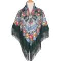 Detailed view of the dark green ethnic floral print square shawl with elegant fringe border. - Dark Green