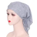 Detail closeup of the elegant grey rhinestone floral headscarf fabric design for women. - Gray
