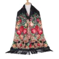 Close-up detail of the vintage ethnic black floral printed shawl with elegant black fringe. - Black