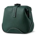 Dark green genuine leather cosmetic bag featuring kiss-lock closure and white contrast stitching. - Dark Green