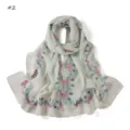 Detailed shot of the floral print chiffon long scarf in light green, spring accessory. - Red Gold Flower