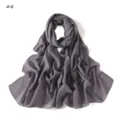 Detailed view of the grey lightweight striped scarf featuring subtle colorful glitter threads. - #4 Grey
