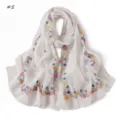 Close-up detail of white chiffon scarf with vibrant floral print, soft and lightweight. - Beige Geometric