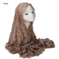 Detail view of the shiny crinkled sheer hijab scarf featuring delicate lettuce edge finish. - Mousse Brown