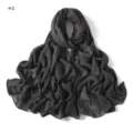 Detailed view of the dark grey crinkled cotton scarf with rolled edges and soft texture. - 2#