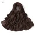 Detailed view of soft crinkled dark brown rayon scarf with rolled edges and fine texture. - Size 7