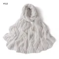 Detail view of lightweight white scarf featuring thin vertical stripes and colorful sequins. - Style 12