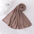 Detailed view of the soft crinkled hijab scarf in brown, lightweight and breathable fabric. - Brown