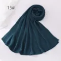Dark green crinkle hijab detail view, lightweight polyester fabric texture, elegant drape. - Dark Green