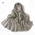 Detail view of the solid color shiny satin scarf, showing the soft draped texture and glossy finish. - Geometric #5