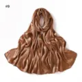 Detailed view of the silky satin jacquard long scarf showing soft texture and elegant leaf pattern. - Style #9