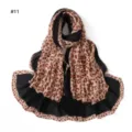 Close-up of pleated leopard print scarf detail showing soft textured fabric and color blocks. - Style #11