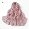 Close-up detail of the pink crinkled satin scarf showing soft texture and glossy drape. - Style 15