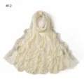 Detailed view of the rhinestone embellished wave edge mercerized cotton scarf hijab. - Khaki