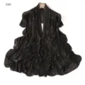 Detailed view of the black mesh shawl featuring sparkling rhinestone star motifs and soft drape. - 24#