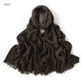 Detailed view of the dark brown wrinkled slub cotton scarf showing fine texture and fringe edge. - Dark Brown