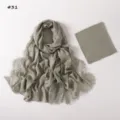 Detail view of the soft modal lace hijab scarf and matching stretch tube cap set in sage green. - 190cm / Style 31