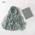 Detailed close-up view of the sage green modal lace scarf and matching inner tube cap set. - 190cm / Style 32