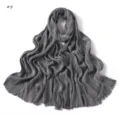 Detailed view of a grey pleated soft long scarf with frayed edges, fine crinkled texture. - Geometric #5