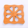 Wooden heat insulation pad for dining table, anti-slip coaster with creative hollow design. - Square Plum Blossom