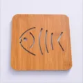 Square bamboo heat insulation mat with cute hollow fish bone design, non-slip pot coaster. - Fish
