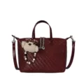 Burgundy woven dumpling handbag for women with cute bear pendant and stylish crossbody strap. - Red