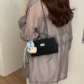 Classic black quilted shoulder bag with chain strap, metal lock and cute bear charm. - With Pendant / Black