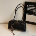 Black retro leather bowling bag women's versatile shoulder handbag commuter pillow bag. - Black (With Pendant)