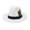 Close-up view of a white felt fedora hat with black ribbon band and decorative feather detail. - 58cm / White