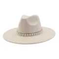 Close-up detail of beige suede jazz hat featuring rhinestone pearl tassel band decoration. - 58cm / Beige