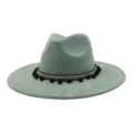 Green faux suede fedora hat with bohemian woven band and pom poms for men and women detail view - Pickle Green